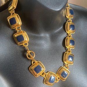 Gold tone and Navy neck piece.